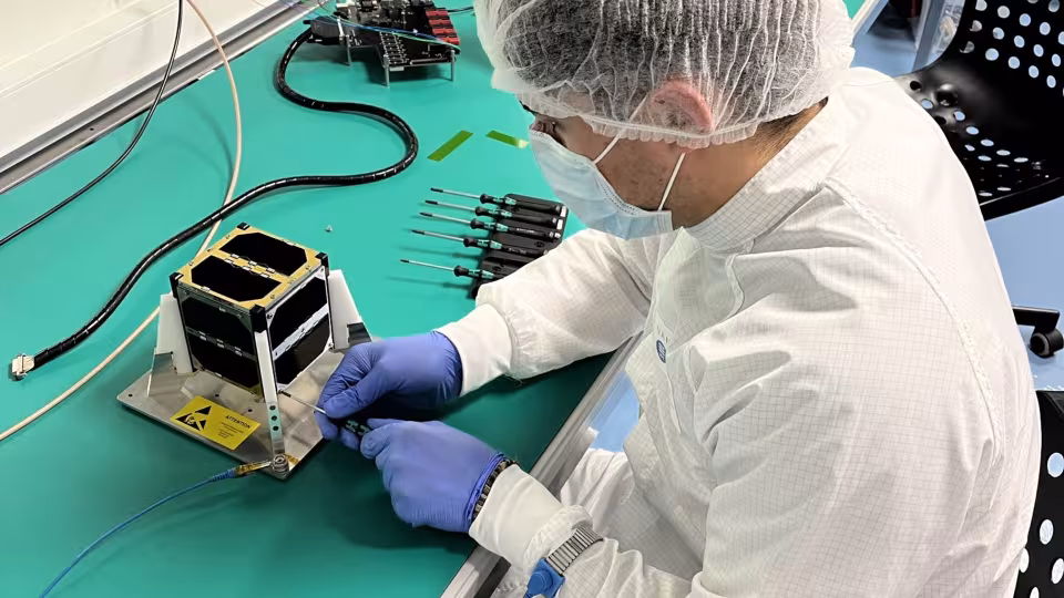 Student working on CubeSat Satellite. Picture by European Space Agency ESA. 